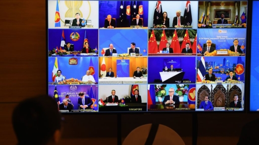 Representatives of signatory countries are pictured on screen during the signing ceremony for the Regional Comprehensive Economic Partnership (RCEP) trade pact at the ASEAN summit that is being held online in Hanoi on November 15, 2020. (Photo by Nhac NGUYEN / AFP) (Photo by NHAC NGUYEN/AFP via Getty Images)